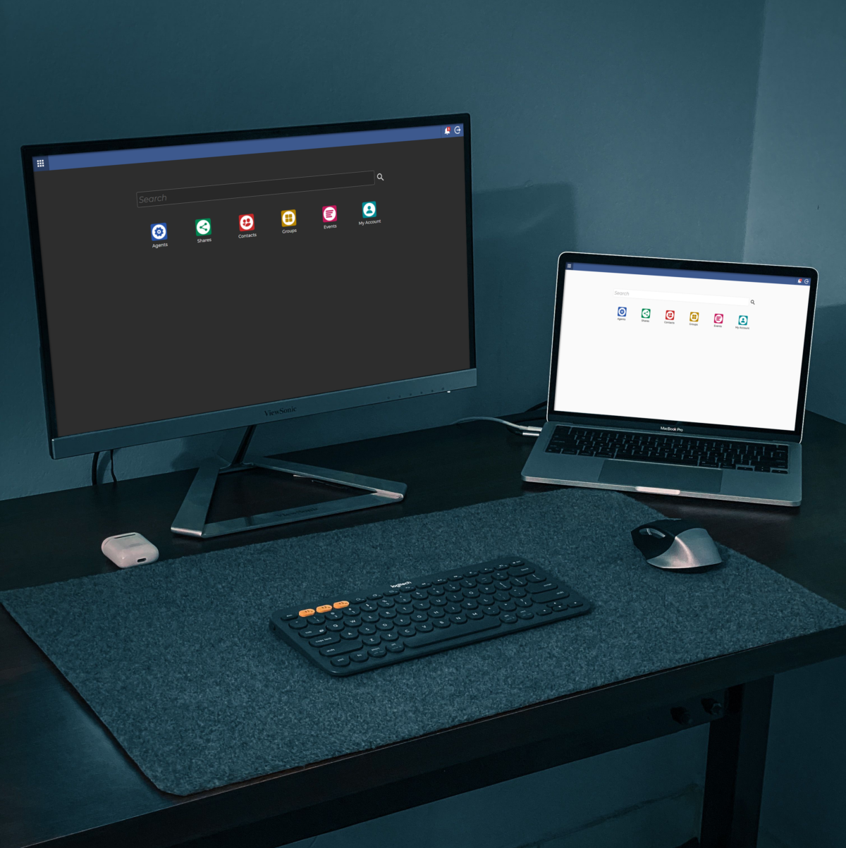 dark mode, dark theme, a PC and a laptop setup on a computer table,